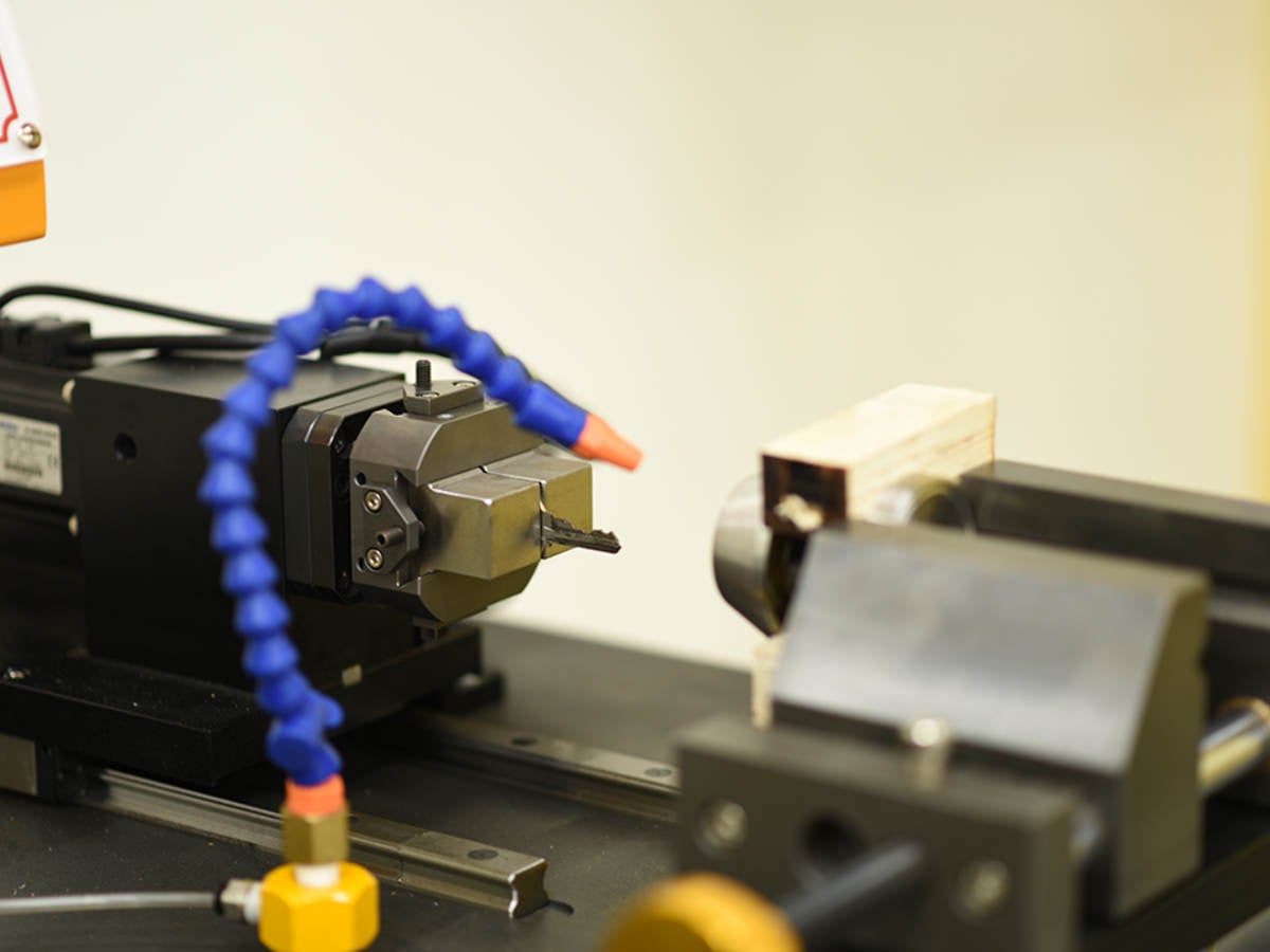 A lock cylinder being cycled to determine durability of the mechanism